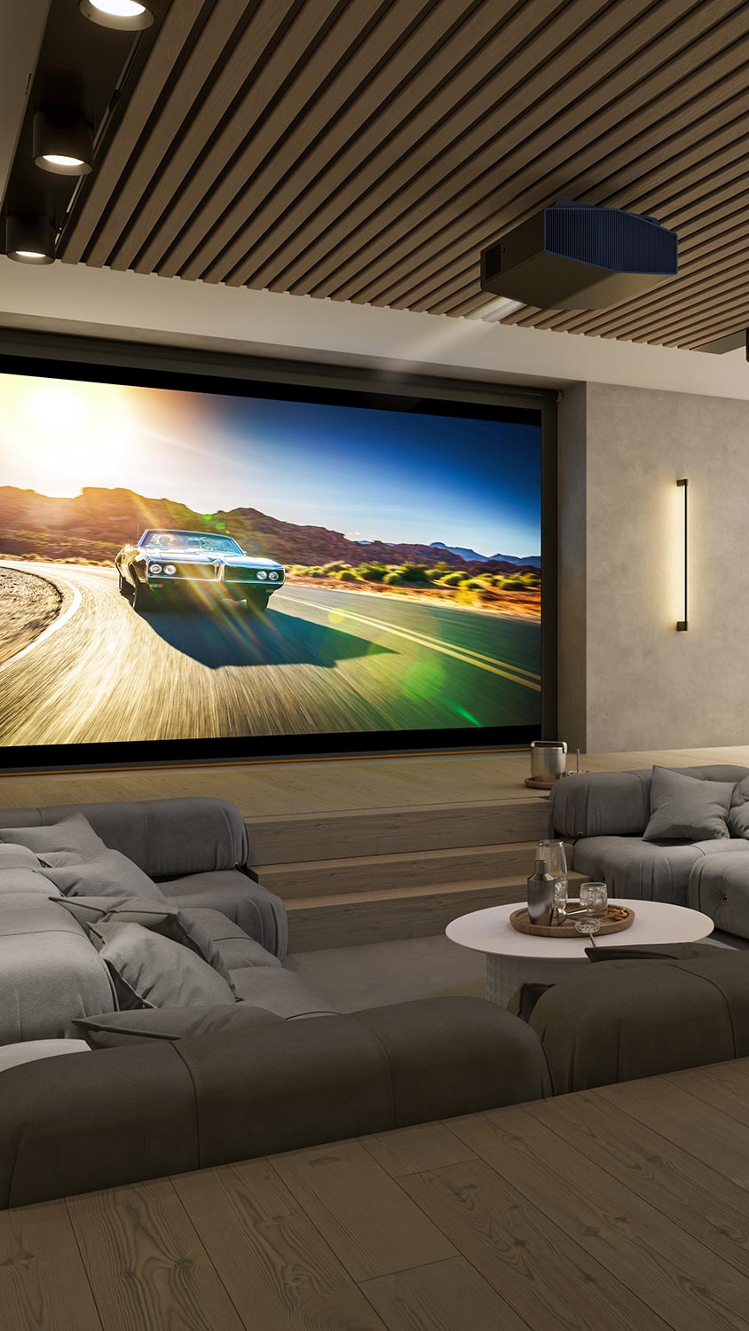 Modern home theater with large projection screen and plush sofas