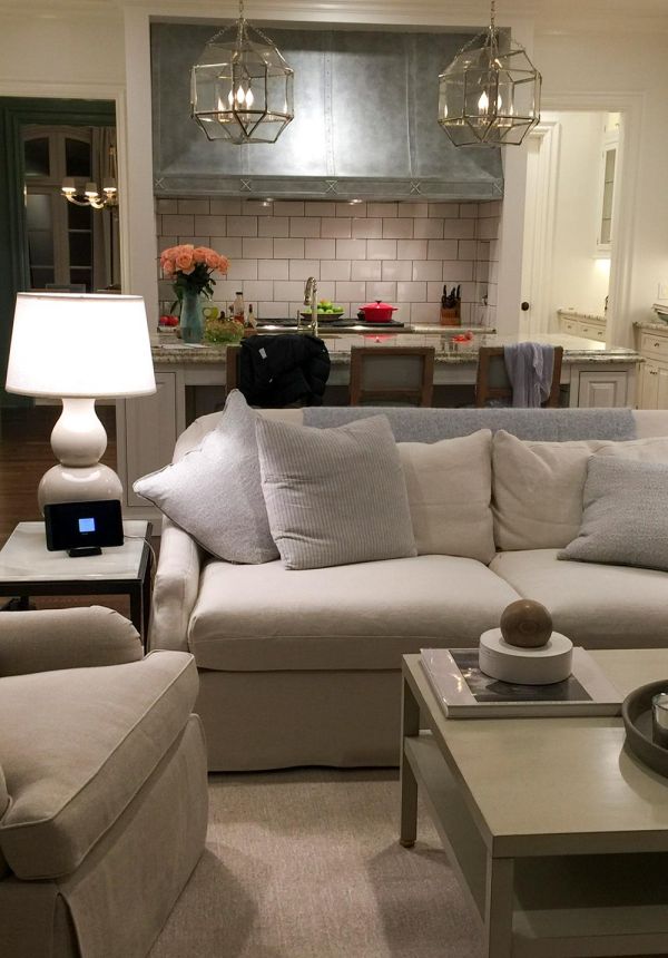 Living room with white sofa and small smart display