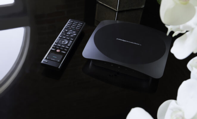 Cozy living room with a fireplace and a large mirror above it.