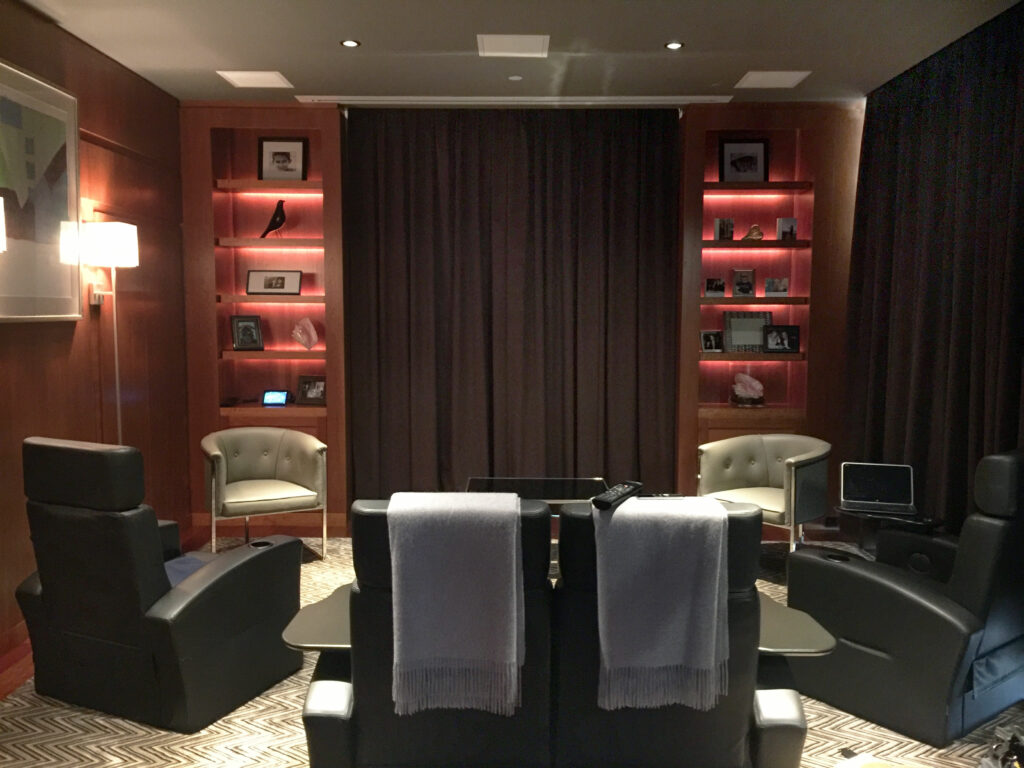 Elegant spa room with massage tables and soft lighting.